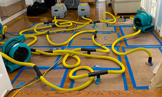 Professional Flood Damage Restoration technician working in Cheyenne, WY